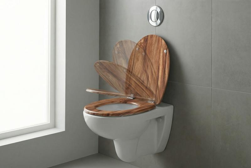 Vergleich: Erhöhter WC-Sitz vs. Toilettengestell – Was ist die beste Lösung?